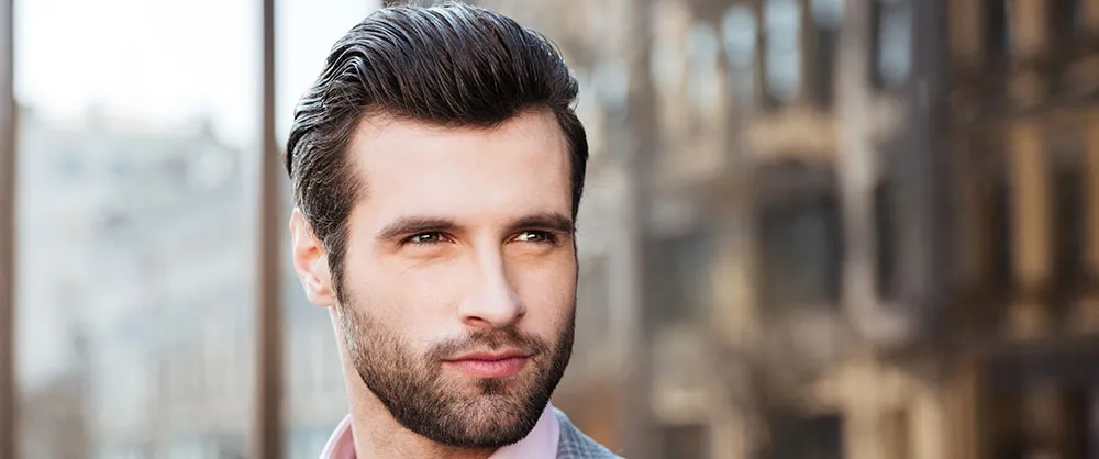 Patient with full, restored hair after treatment at The Dermatology, Laser & Vein Center